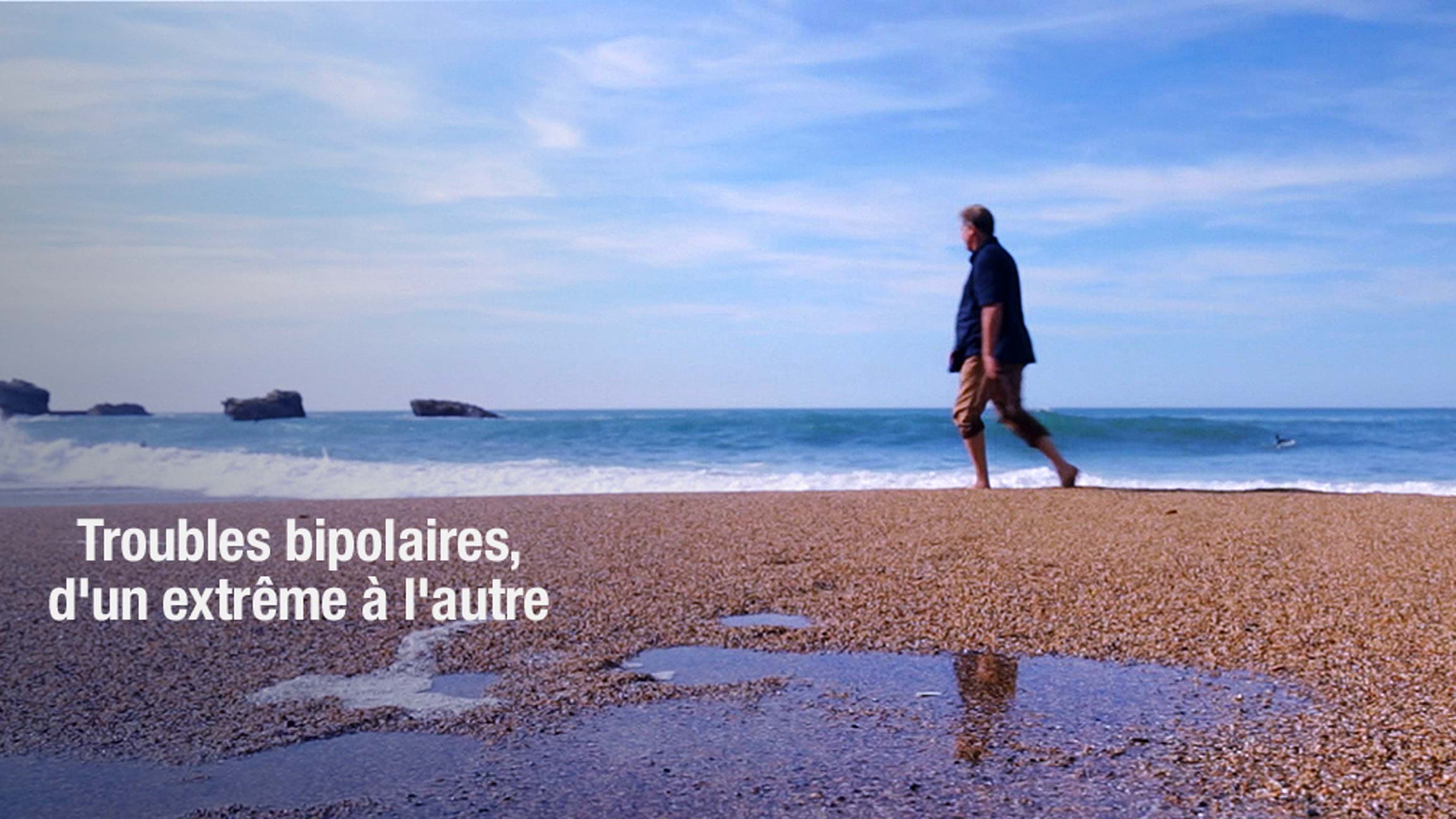 Description de l'image : un homme marche sur une plage. On peut lire le titre : "Bipolaires, d'un pôle à l'autre".
